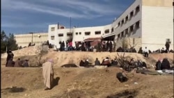 Civilians search notorious Syrian prison for loved ones 