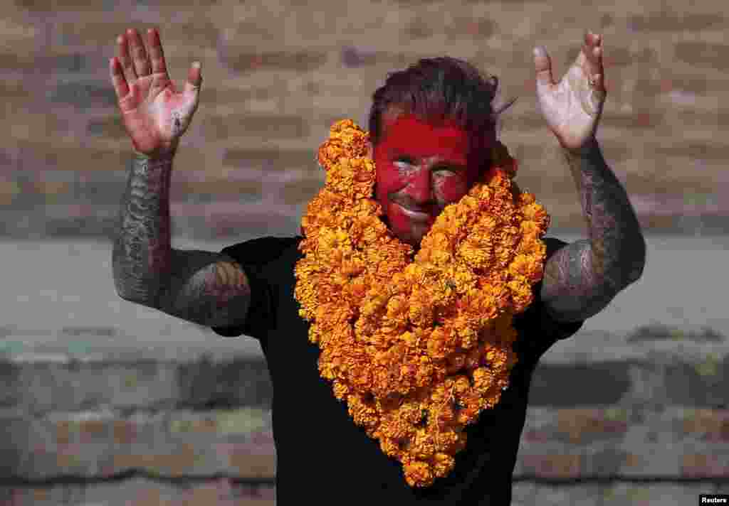 David Beckham waves toward his fans after playing a charity match to collect funds for the United Nations Children&#39;s Fund (UNICEF) in the ancient city of Bhaktapur, Nepal.