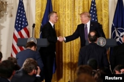 U.S. President Donald Trump, right, and NATO Secretary General Jens Stoltenberg