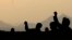 Muslim pilgrims cast stones at a pillar, symbolizing the stoning of Satan, a rite of the annual hajj, in Mina near the holy city of Mecca, Saudi Arabia, Oct. 16, 2013. 