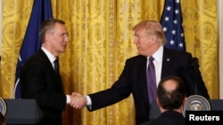 U.S. President Donald Trump and NATO Secretary General Jens Stoltenberg at a news conference in Washington, April 12, 2017