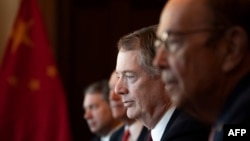 US Trade Representative Robert Lighthizer (C) and US Secretary of Commerce Wilbur Ross (R) talk with the Chinese Delegation, including Vice Premier Liu He, during US-China Trade Talks in Washington, DC, on January 30, 2019.