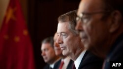 US Trade Representative Robert Lighthizer (C) and US Secretary of Commerce Wilbur Ross (R) talk with the Chinese Delegation, including Vice Premier Liu He, during US-China Trade Talks in Washington, DC, on January 30, 2019.