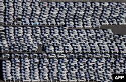 FILE - New Porsche cars are parked at the grounds of the Porsche plant in Leipzig, eastern Germany, Nov. 3, 2015.
