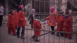 Syrian Children Locked in Cage in Protest Echoing IS Video