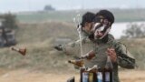 A South Korean army special forces soldier breaks bottles with his hand during the Naktong River Battle re-enactment in Waegwan.