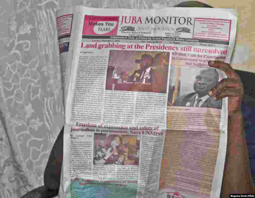 A person reads The Juba Monitor on the day the paper ran the story about the U.N. Mission in South Sudan's (UNMISS) Plan of Action on the Safety of Journalists.South Sudan has agreed to test drive the plan, which calls for defamation to be decriminalized and greater protections for journalists. (VOA/Mugume Davis)