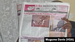 A person reads the Juba Monitor on the day the paper ran the story about the U.N. Mission in South Sudan's (UNMISS) Plan of Action on the Safety of Journalists. South Sudan has agreed to test drive the plan, which calls for defamation to be decriminalized.