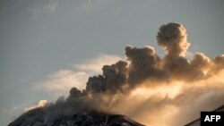 FILE - A view of the Nevados de Chillan volcano complex during an eruptive pulse in Las Trancas, 380 kilometers south of Santiago.
