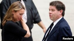 A mourner weeps outside the funeral services of James Gandolfini at the Cathedral Church of Saint John the Divine in New York, June 27, 2013.