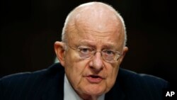 Director of the National Intelligence James Clapper participates in the Senate Intelligence Committee's hearing on worldwide threats, Feb. 9, 2016, on Capitol Hill in Washington.