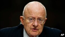 Director of the National Intelligence James Clapper participates in the Senate Intelligence Committee's hearing on worldwide threats, Feb. 9, 2016, on Capitol Hill in Washington.