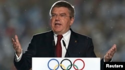 FILE - International Olympic Committee (IOC) President Thomas Bach delivers a speech during the closing ceremony of the 2014 Nanjing Youth Olympic Games in Nanjing, Jiangsu province, August 2014.
