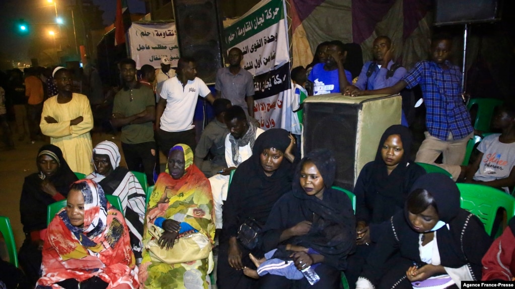 Sudanese protesters take to the streets in the capital Khartoum durning a demonstration demanding the dissolution of the transitional government on Oct. 18, 2021.