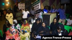 Sudanese protesters take to the streets in the capital Khartoum durning a demonstration demanding the dissolution of the transitional government on Oct. 18, 2021.