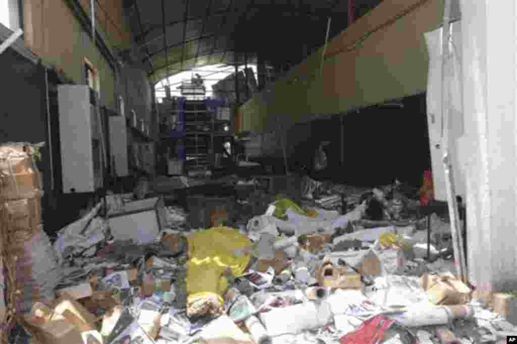 Debris is strewn inside the bombed office of ThisDay, an influential daily newspaper in Abuja, Nigeria, Thursday, April. 26, 2012.