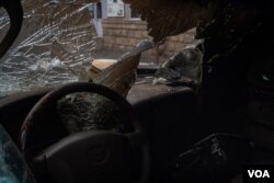 A burned-out car near a telecom in Nagorno-Karabakh, Oct. 9, 2020. (Yan Boechat/VOA)
