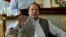 Former prime minister and leader of Pakistan Muslim League-N party, Nawaz Sharif, gestures while speaking to members of the media at his residence in Lahore, Pakistan, May 13, 2013.