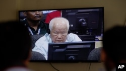 FILE - Khieu Samphan, former Khmer Rouge head of state, is seen on screen at the court's press center at the U.N.-backed war crimes tribunal on the outskirts of Phnom Penh, Cambodia, Nov. 16, 2018. 