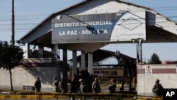 Soldiers guard the Senkata fuel plant in El Alto, Bolivia, Nov. 22, 2019. At least eight people were killed Nov. 19 when police and soldiers cleared a blockade at the plant by supporters of former President Evo Morales.