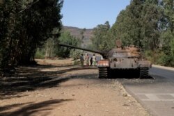 A burned tank stands near the town of Adwa, Tigray region, Ethiopia, March 18, 2021.