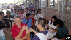 Residents line up to receive yellow fever vaccinations in Clorinda, Argentina on Feb. 20, 2008, after cases of the disease were reported near the capital, Asuncion.