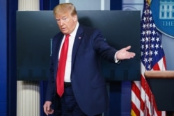 FILE - U.S. President Donald Trump leaves after speaking to the press on May 22, 2020, in the Brady Briefing Room of the White House in Washington, DC. Trump urged state governors to allow places of worship to reopen immediately.