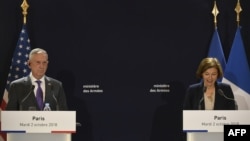 French Defense Minister Florence Parly speaks next to US Defense Secretary Jim Mattis during a press conference after their meeting at the French Defence ministry in Paris, Oct. 2, 2018. 