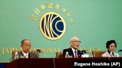 From left, Jiro Hamasumi, Terumi Tanaka and Michiko Kodama, members of the Japan Confederation of A- and H-Bomb Sufferers Organizations, attend a press conference at Japan National Press Club Tuesday, Dec. 24, 2024, in Tokyo. (AP Photo/Eugene Hoshiko)