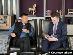 Sikyong Penpa Tsering, left, political leader of the Central Tibet Administration, talks with VOA on the sidelines of the Forum 2000 democracy conference in Prague, Oct. 13, 2024. (Tenzin Dhadon)