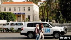 FILE - A United Nations vehicle carrying Organization for the Prohibition of Chemical Weapons (OPCW) inspectors is seen in Damascus, Syria, April 17, 2018.