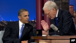 President Barack Obama talks with David Letterman on the set of the "Late Show With David Letterman" in New York, Sept. 18, 2012. 