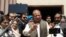 FILE - Pakistan's former Prime Minister Nawaz Sharif talks to media after appearing before the accountability court to face the corruption references filed against him, in Islamabad, Pakistan, April 17, 2018. 