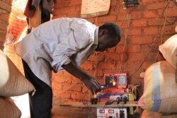 The program helped some villagers, like Mailosi Banda a tradition leader for Kainja village, get into the battery-charging trade. (Lameck Masina, VOA)