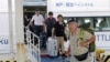 Stranded Passengers Evacuated from Japanese Airport Damaged by Typhoon 