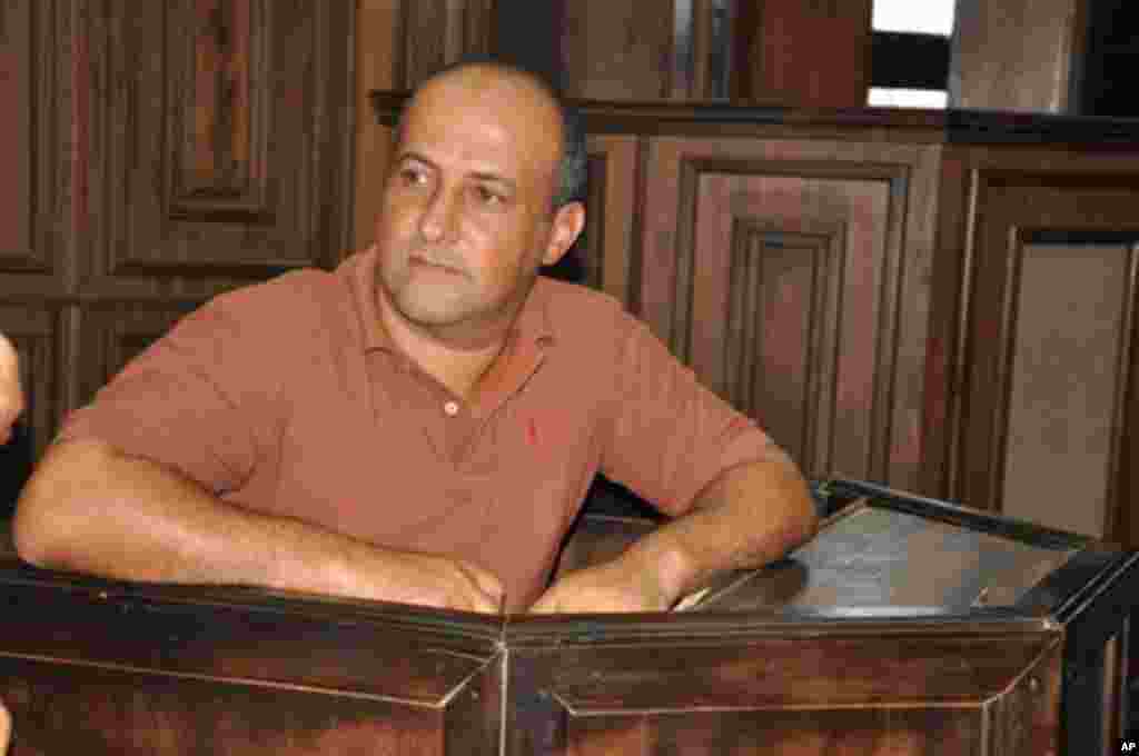 Talal Ahmad Roda, a Nigerian-Lebanese man accused of belonging to Hezbollah, sits in the court where he was sentenced to life imprisonment at the Federal High Court in Abuja, Nov. 29, 2013.