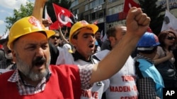 Miners join nearly 2,000 university students, some wearing miners' hard-hats, who called on the government to resign in Ankara, Turkey, May 19, 2014.