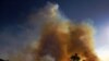 PARA – Smoke rises from an illegally lit fire in Amazon rainforest reserve, south of Novo Progresso in Para state, Brazil, on August 15, 2020. (Photo by CARL DE SOUZA / AFP).