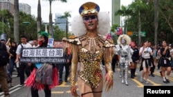 People wearing costumes participate in the annual Taiwan's Pride parade in Taipei, Taiwan, Oct. 26, 2024. 