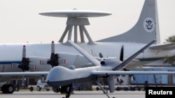 FILE - In this Nov. 8, 2011 file photo, a Predator B unmanned aircraft taxis at the Naval Air Station in Corpus Christi, Texas.