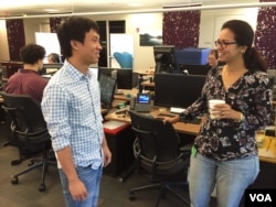 Tang Kengsreng talks to an Indian co-worker. According to recent census data compiled by the Silicon Valley Institute for Regional Studies, more than a third of its working residents are foreign-born, much higher than the national average of about 13 percent. (Sophat Soeung/VOA Khmer)