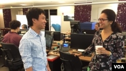 Software engineer Tang Kengsreng, 29, talks to an Indian co-worker at the headquarters of Cisco Systems, a technology company, in San Jose, September 1, 2016.