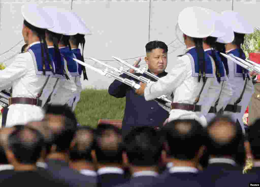 North Korean leader Kim Jong-un salutes as honor guards march past at the cemetery for fallen fighters of the Korean People&#39;s Army in Pyongyang,&nbsp;July 25, 2013.