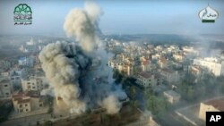  This still image taken from drone footage, posted online by the communications arm of Ahrar al-Sham militant group, purports to show a blast on the ground, apparently the result of an airstrike, in a Syrian-government controlled neighborhood of Aleppo, S