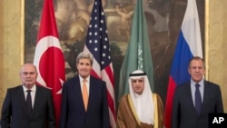 From left, Turkey's Minister of Foreign Affairs, Feridun Sinirlioglu, U.S. Secretary of State John Kerry, Saudi Arabia's Minister of Foreign Affairs Arabia Adel al-Jubeir and Russia's Foreign Minister Sergey Lavrov during a meeting in Vienna, Oct. 23, 