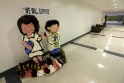 FILE - A flower arrangement is shown at Jackson Memorial Hospital, July 13, 2020, in Miami. Florida's rapidly increasing number of coronavirus cases is turning Miami into the "epicenter of the pandemic," a top doctor warned this week.