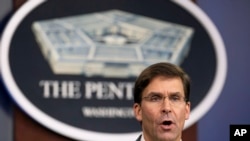 FILE - U.S. Secretary of Defense Mark Esper speaks to reporters during a briefing at the Pentagon, outside Washington, Aug. 28, 2019.