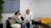 Released Israeli hostage Agam Berger is embraced by her parents, following her release, in an unknown location in Israel, in this screengrab from a handout video obtained by Reuters on Jan. 30, 2025. 