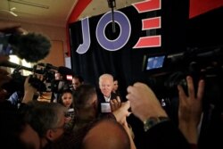 Democratic presidential candidate former Vice President Joe Biden is surrounded at a campaign event in Somersworth, N.H., Feb. 5, 2020.