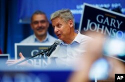 FILE - Libertarian presidential candidate Gary Johnson campaigns in Parker, Colo., in early October.